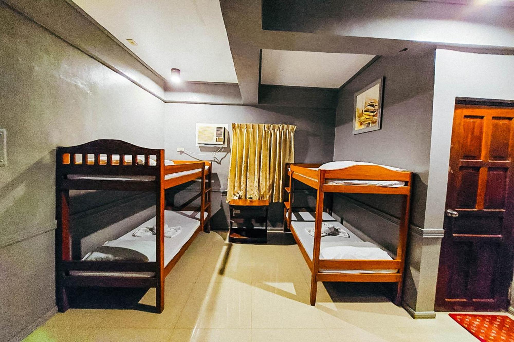 Mbg Travellers Inn Powered By Cocotel Puerto Princesa Oda fotoğraf