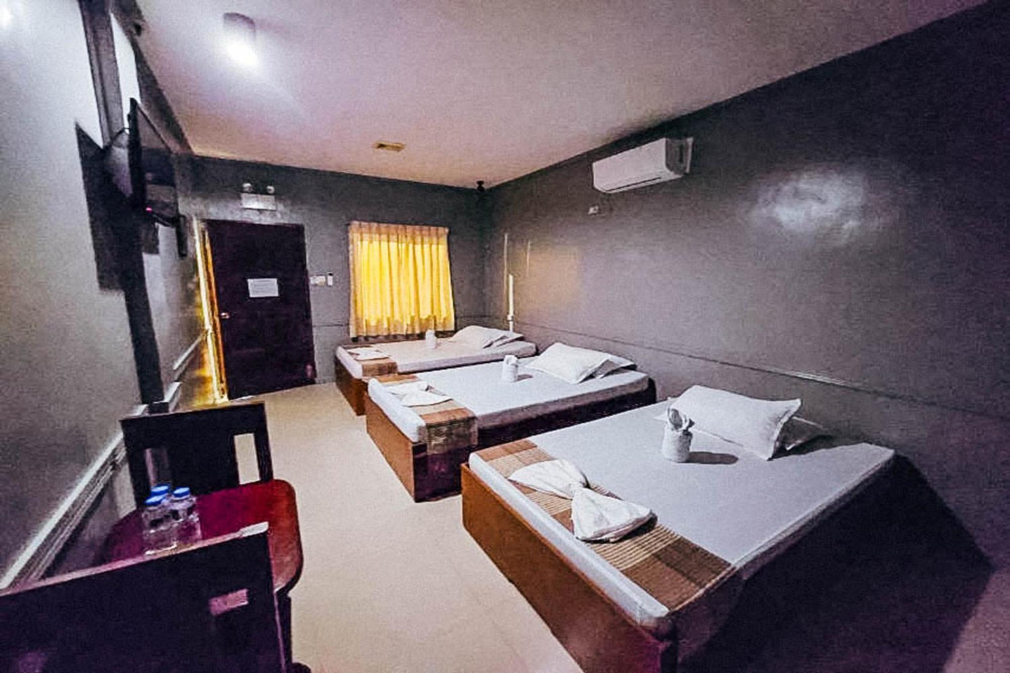 Mbg Travellers Inn Powered By Cocotel Puerto Princesa Oda fotoğraf