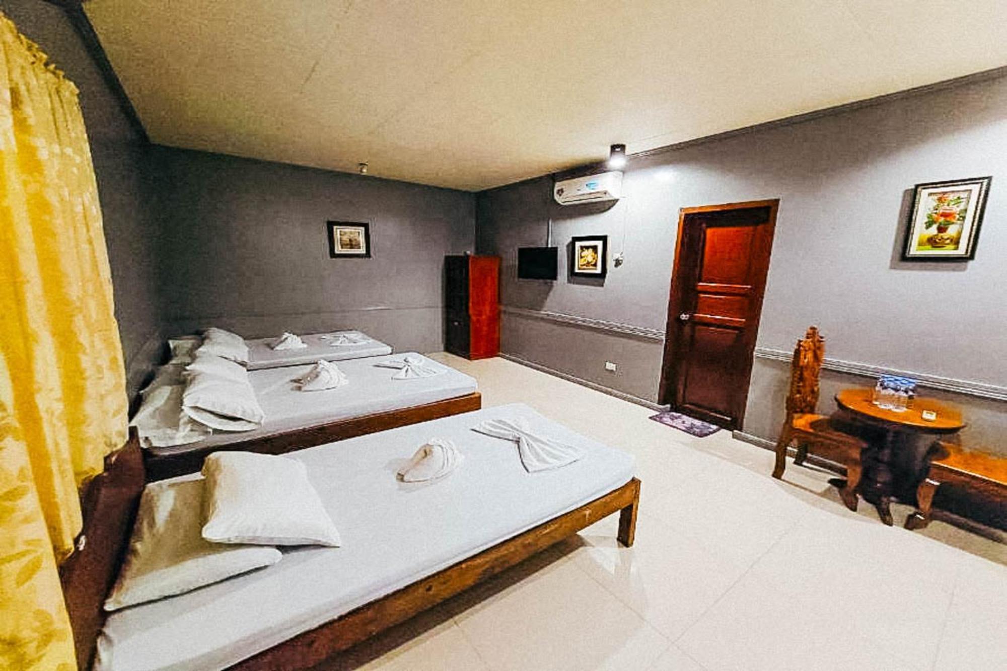 Mbg Travellers Inn Powered By Cocotel Puerto Princesa Oda fotoğraf
