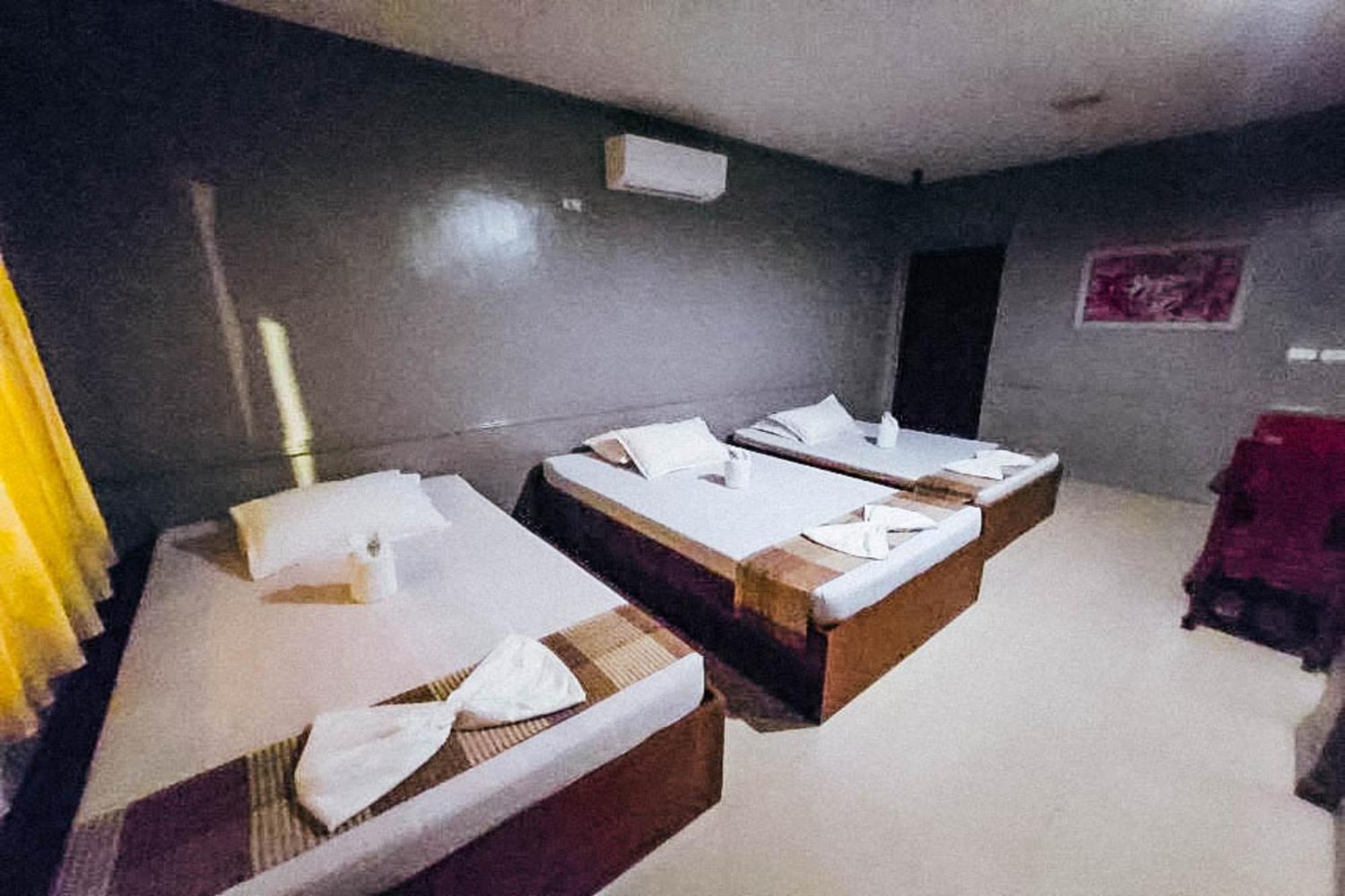 Mbg Travellers Inn Powered By Cocotel Puerto Princesa Oda fotoğraf